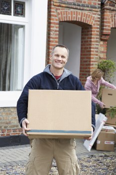 Removal van and moving boxes in Barnet residential street