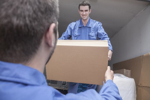 Moving team handling boxes safely during a home removal