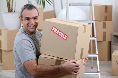 Man and van removals loading furniture in Barnet