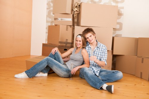 Careful packing of books and electronics for student removals