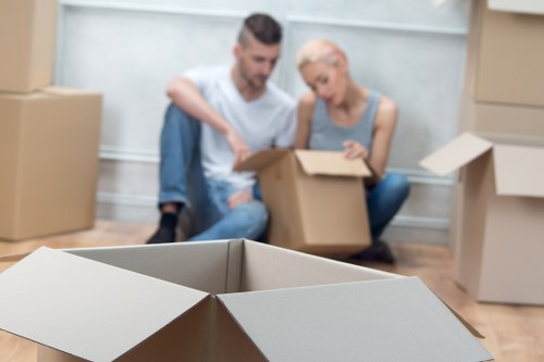 Professional movers packing boxes for a Barnet house relocation