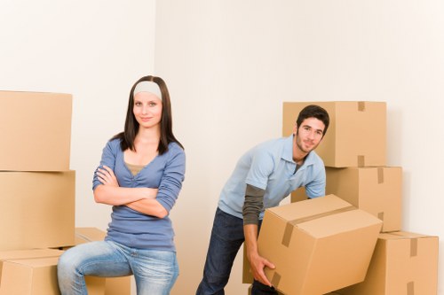 Packed office boxes and labelled equipment staged for transport in Barnet