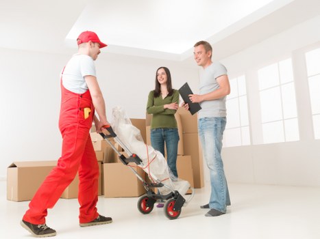 House removal team handling furniture in Barnet